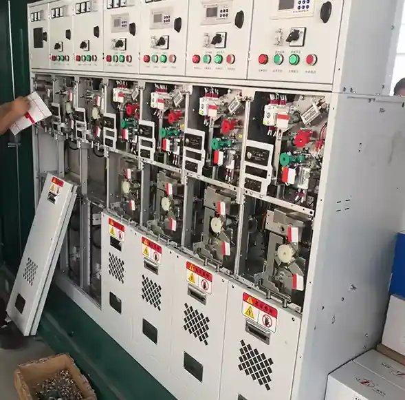 Technician performing maintenance on a sealed ring main unit (RMU)